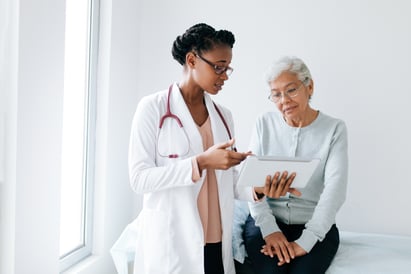 A female physician discusses test results with an older, female patient
