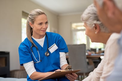 A medical professional speaks with a patient