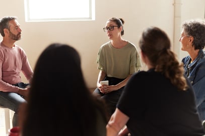 A woman speaks in a support group