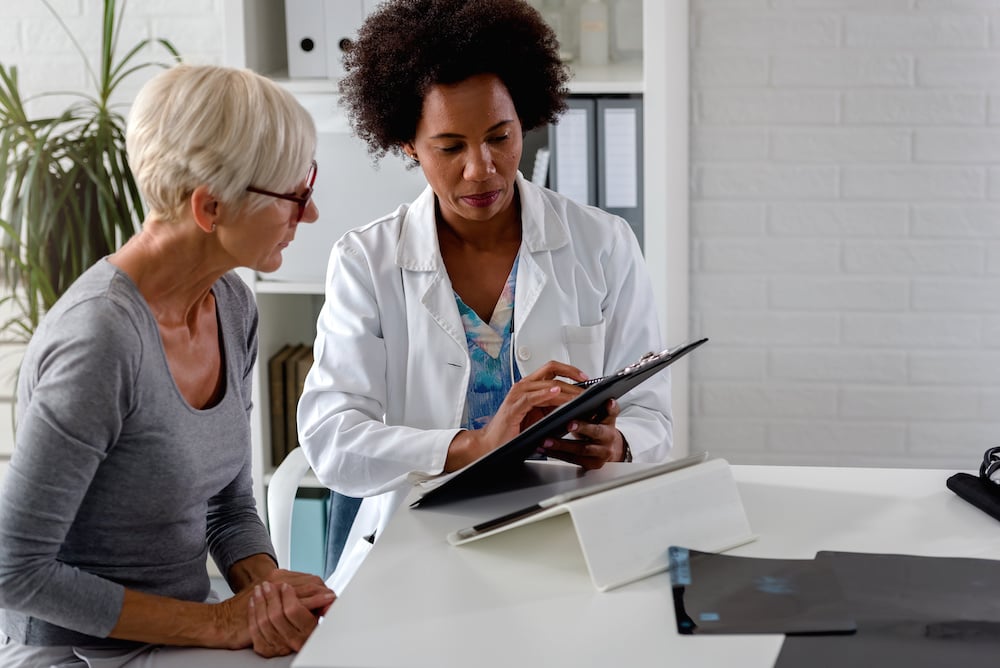 woman talking with doctor