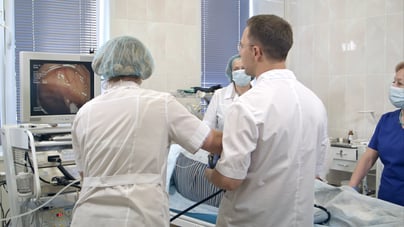 A team of doctors reviewing images from colon cancer screening  