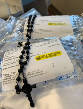 chemo bag wrapped in rosary, using both faith and colon cancer care team to fight cancer