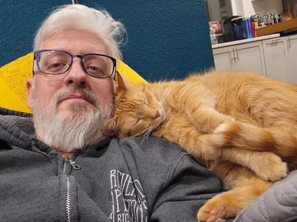 Dan Hawthorne with his cancer-detecting cat Simba