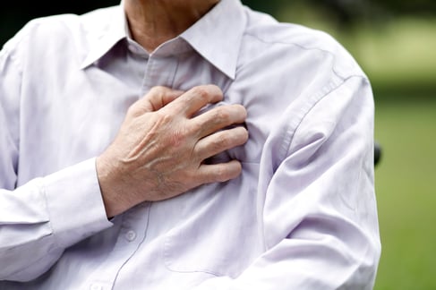 Senior man experiencing chest pain