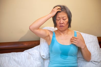 woman experiences hot flash from adjuvant therapy side effects