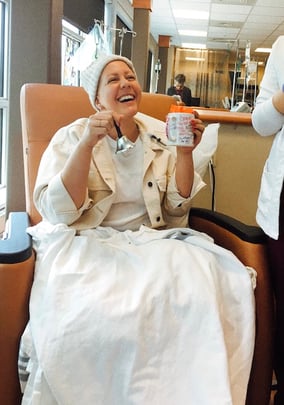 Patient Anna ringing the bell after receiving treatment 