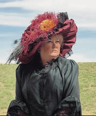 Janet Kalstrom poses in costume as The Unsinkable Molly Brown