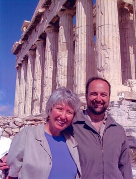 two-time cancer survivor and husband in front of Parthenon