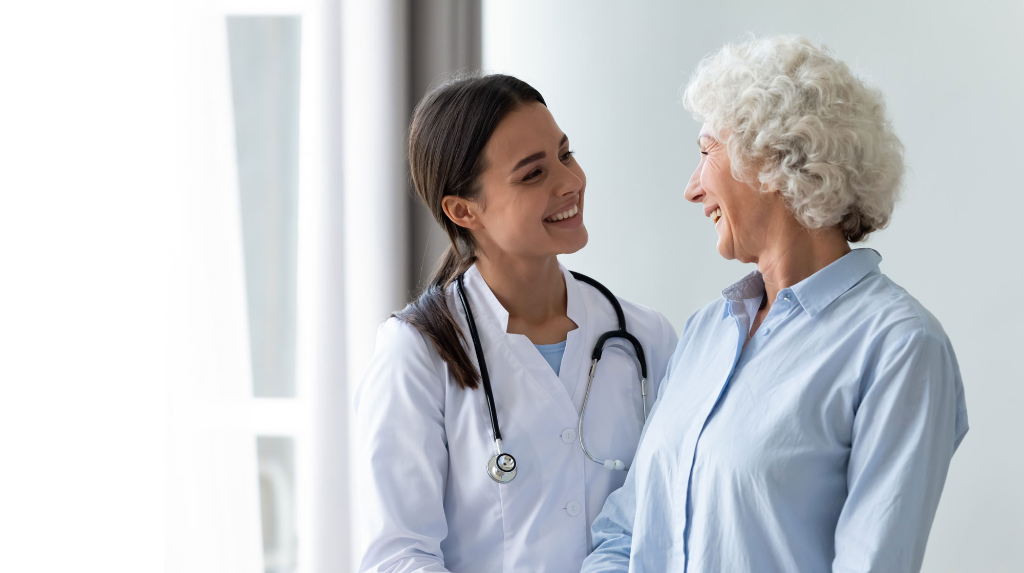 doctor speaks with female patient