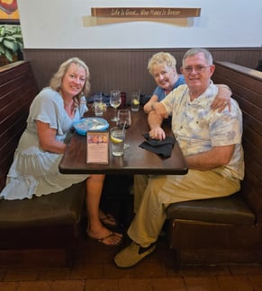Mary enjoys a night out with her husband Joe and daughter Renee at one of their favorite restaurants