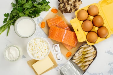Healthy food including salmon, eggs, and greens