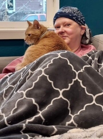 Tara Deerihan with her cancer-detecting cat Simba