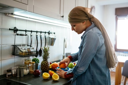 Woman with headscarf preparing food