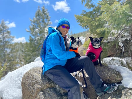 enjoying life is an important part of showing that cancer doesn’t have to defeat you on a winter hike with two dogs