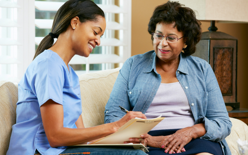 patient speaking with female physician about her health records